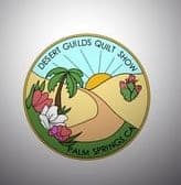 Desert-Springs-Logo A circular logo for the quilt show in Palm Springs, CA features a sun rising over desert hills, palm trees, colorful flowers, and text reading Desert Guilds Quilt Show and Palm Springs, CA.