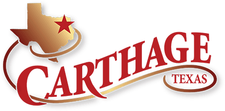 Logo for Carthage, Texas. It features a gold outline of Texas with a red star marking the location, and the words Carthage in large red letters and Texas in a smaller red oval below—perfect for promoting events like the quilt show in Carthage TX.