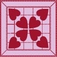 Algood-Logo A quilt pattern featuring red heart shapes on a pink background with a grid and border design. Inspired by the Quilt Festival in Algood TN, four hearts form a central flower-like motif, with additional hearts in each corner.