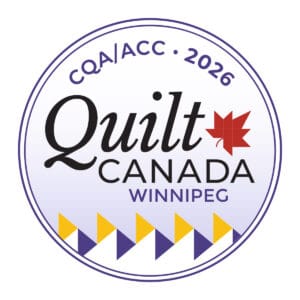 QC26_Logo Circular logo for Quilt Canada 2026 in Winnipeg. “CQA/ACC 2026” sits at the top, Quilt Canada Winnipeg is centered with a red maple leaf dotting the i, and a geometric purple and yellow border—perfect inspiration for Sylvan Lake Quilters Guild Quilt Show.