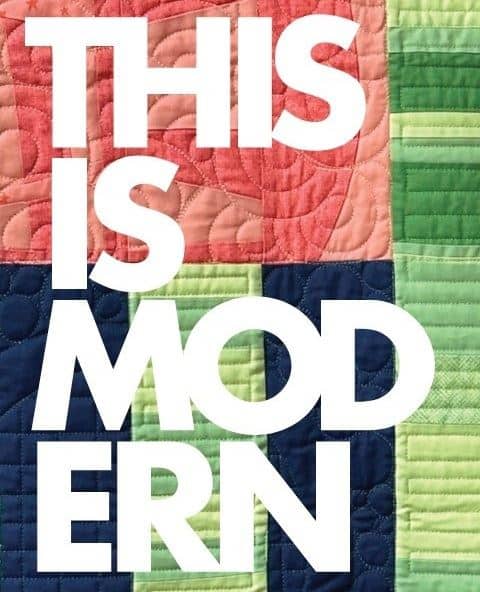 Modern-Quilt-Guild A colorful quilt with green, blue, pink, and yellow patchwork is overlaid with bold white text that reads THIS IS MODERN.