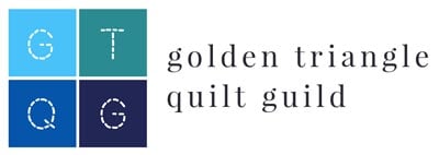 Golden-Triangle-Quilt-Guild-400- Logo with four colored squares, each containing a white stitched letter: G, T, Q, and G. To the right, golden triangle quilt guild is written in lowercase black serif font.