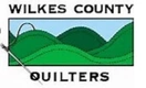 Logo for Wilkes County Quilters with green hills, a blue sky, and a sewing needle and thread on the left side. Perfect for promoting a Quilt Show in North Wilkesboro, North Carolina. The name appears above and below the image.